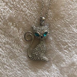 Swarovski necklace of a white cat with aqua eyes